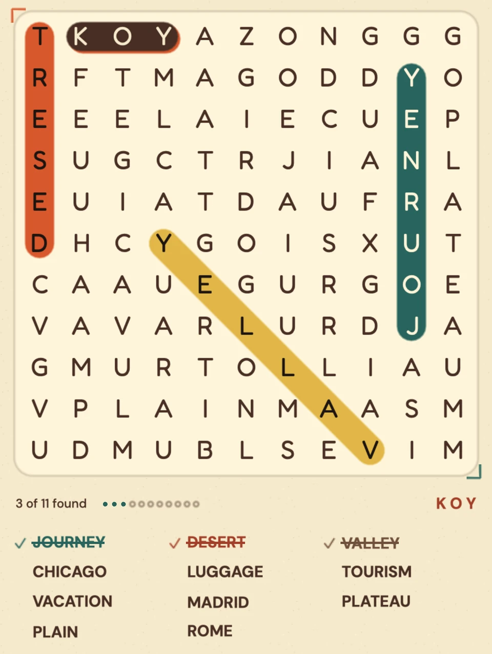 Close up of a board. DESERT runs up the left edge in orange, JOURNEY runs up the right in teal, VALLEY runs diagonally in mustard, and the list below has those three crossed off.